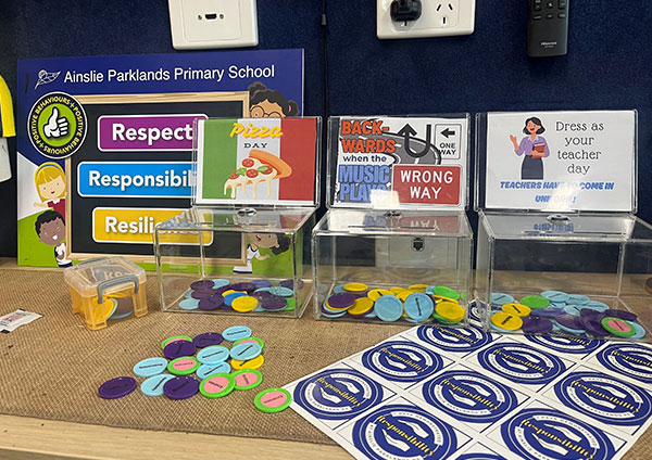 Tokens in clear boxes deciding on a reward
